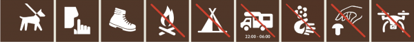 The photograph shows various prohibitions, such as no campfires, no camping, no picking flowers or mushrooms, and dogs must be kept on a leash.